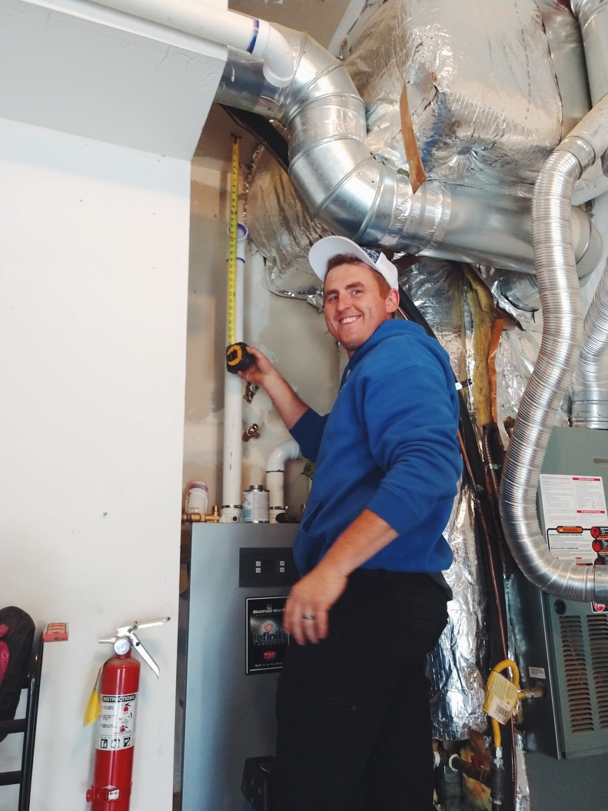 Simpson team member installing a water heater