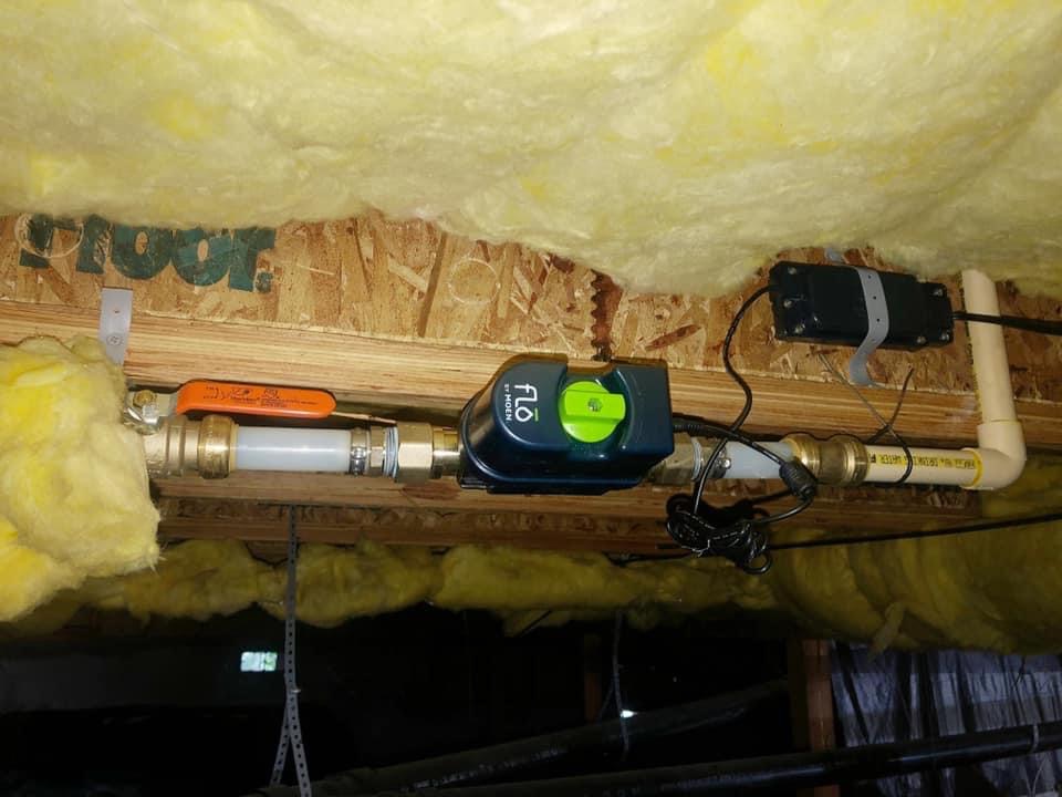 Flo plumbing device under insulation to help illustrate water line repair.