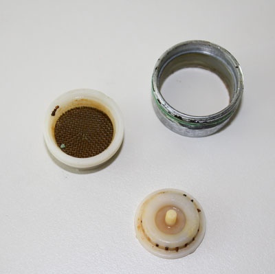 Cleaning a faucet aerator removes hard-water buildup