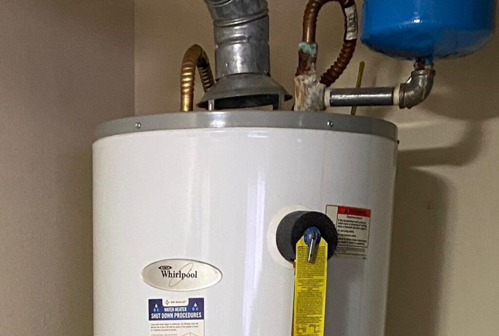 An image of the upper part of a hot water heater to illustrate hot water heater troubleshooting.